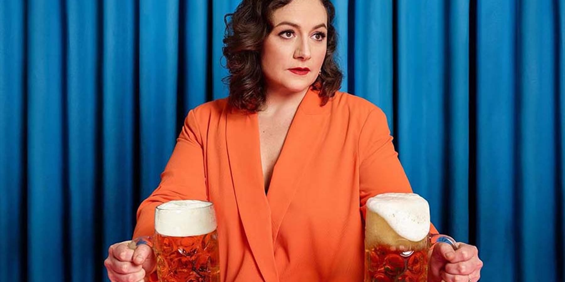 A lady holding two glasses of beer