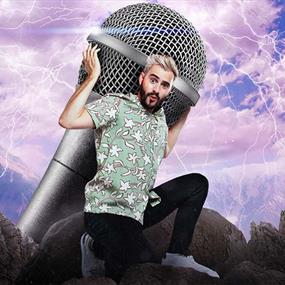 A man holding a giant microphone on his back