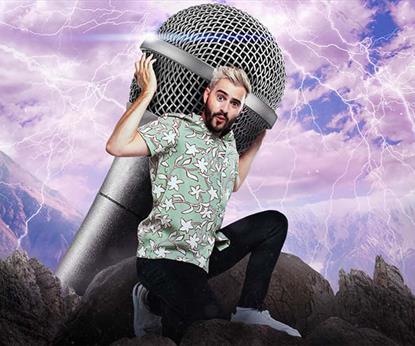 A man holding a giant microphone on his back