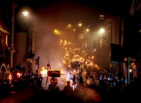 Borough Bonfire society descend Lewes High Street