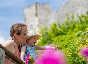 Parent and child in the garden at Lewes Castle