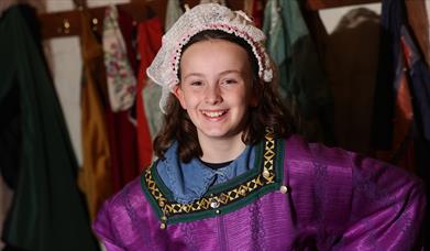 Girl dressed in medieval outfit at Anne of Cleves House