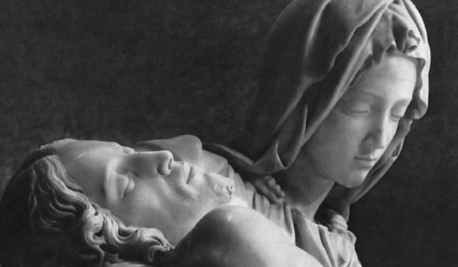 Sculptures of figures with closed eyes at peace