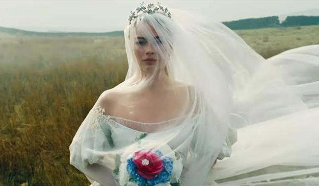 Margot Robbie as Catherine Earnshaw in a wedding dress, in film Wuthering Heights