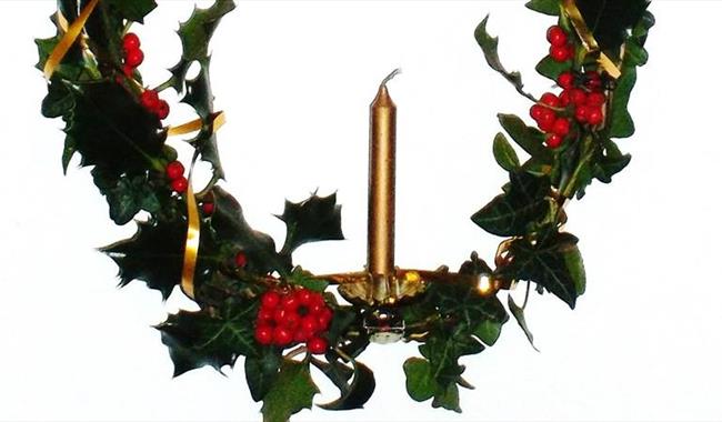 Holly wreath with candle