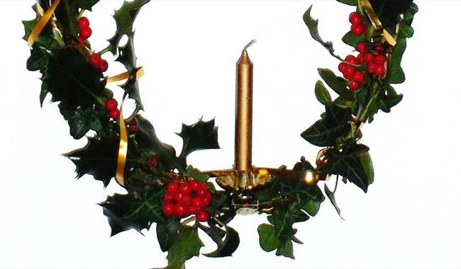 Holly wreath with candle