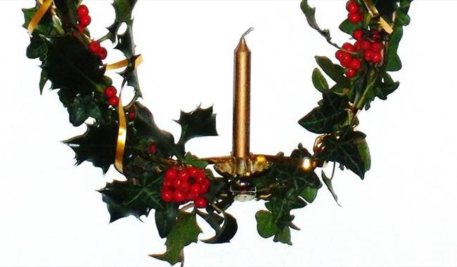Christmas candle with holly