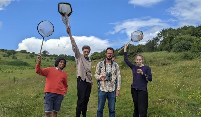 Attendees at Youth Action Project with butterfly nets and cameras