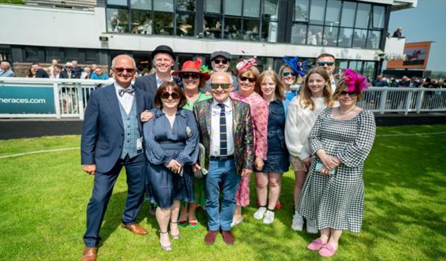 Group of racegoers in the sunshine at Plumpton