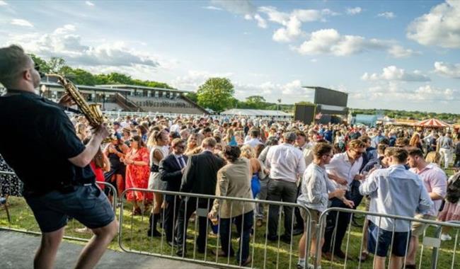 Saxophonist entertaining the crowds at Plumpton Racecourse