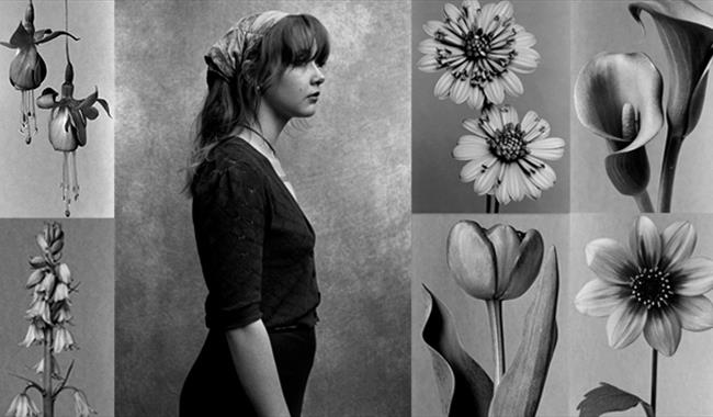 B/w photo of woman with floral / botanical images