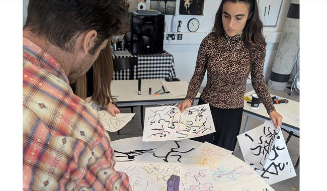 People creating artwork for exhibition