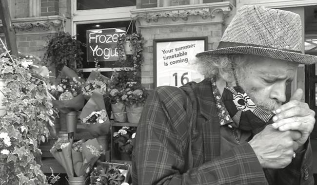 Black and white photo of poet John Agard