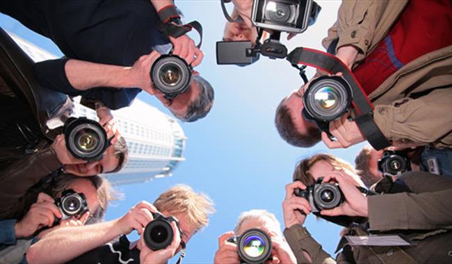 Circle of photographers focussing
