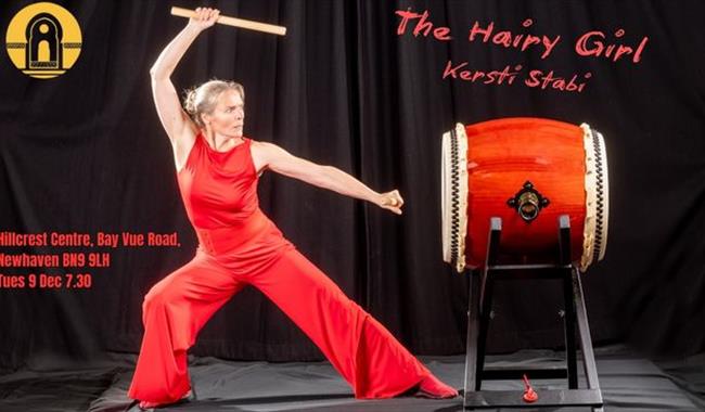 Storyteller Kersti Stabi ready to beat a drum.