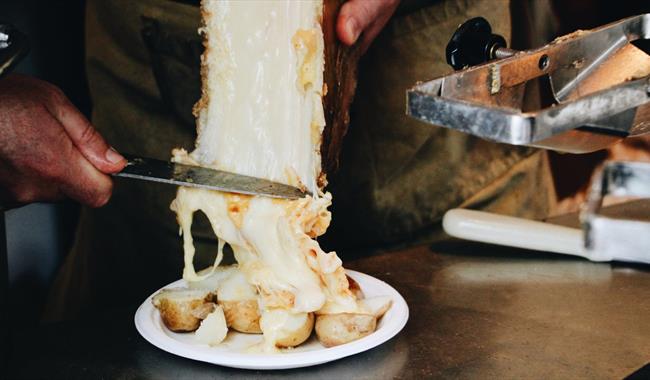 Raclette cheese on potatoes.