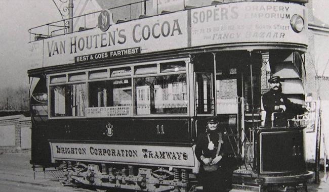 Old b/w photo of open topped tram