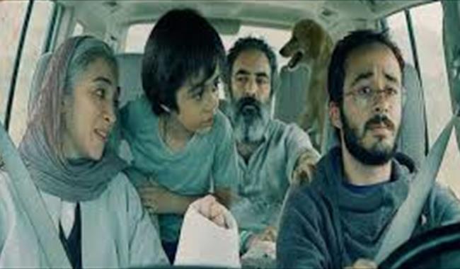 Family travelling in a car in Iran