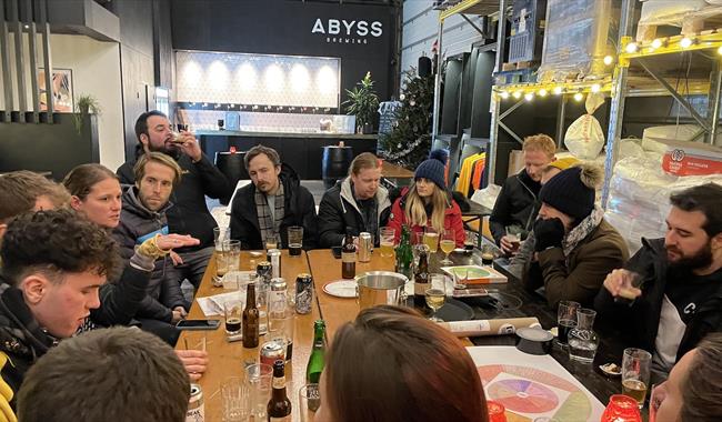 People enjoying a beer at Abyss Brewery