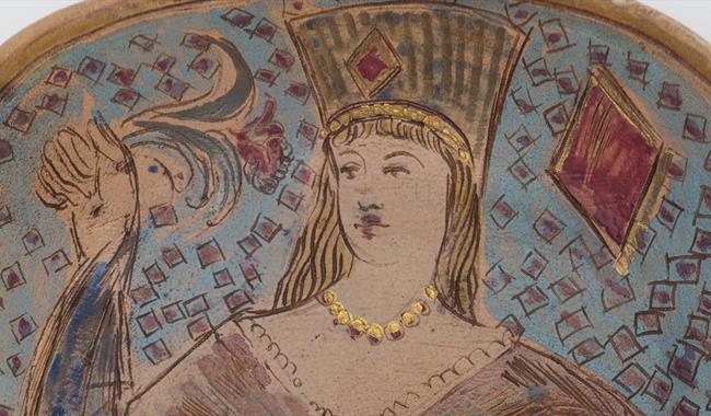 Woman's face painted on ceramic platter