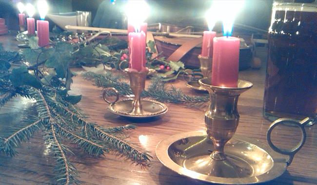 Christmas candles on table setting