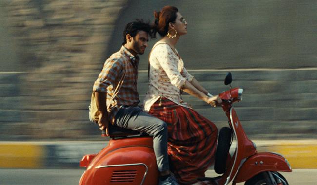 Stars from the Indian film Joyland riding a moped