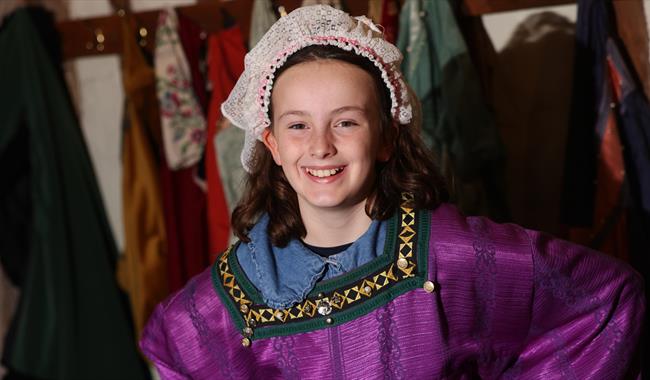 Girl dressed in medieval outfit at Anne of Cleves House