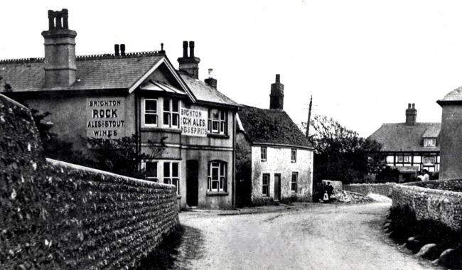 Black and white photograph of the centre of Piddinghoe