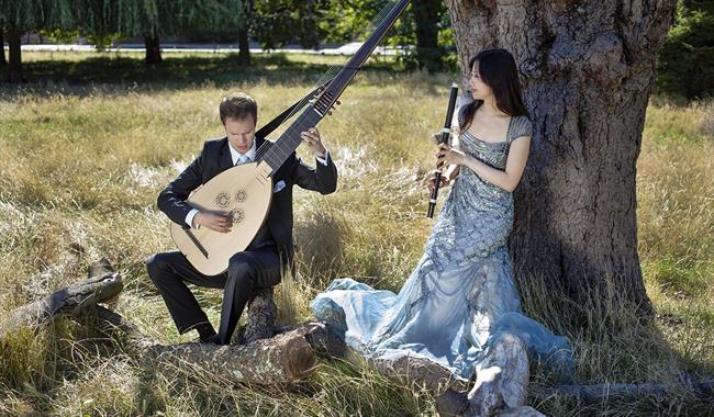 musicians photographed under a tree with lute and recorder