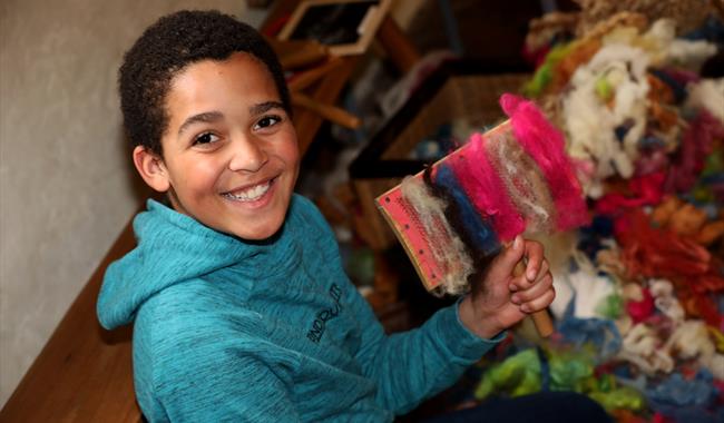 Boy enjoying Tudor Tuesday at Anne of Cleves House