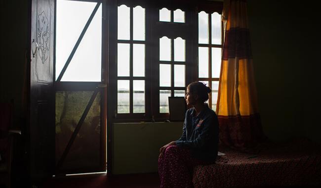 Woman looking out of window