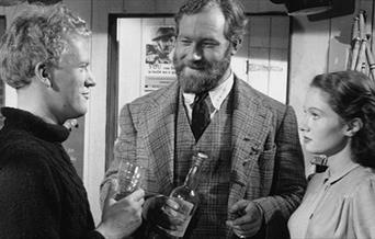 Actors Gordon Jackson, James Robertson Justice and Joan Greenwood in Whisky Galore!



