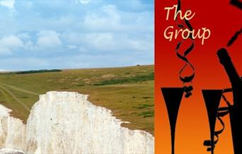 Seven Sisters Cliffs and wine glasses and bottle
