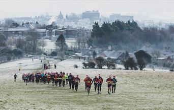 Santas running up the downs