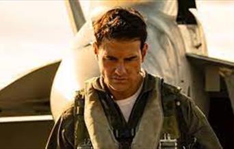 Tom Cruise, starring in Maverick