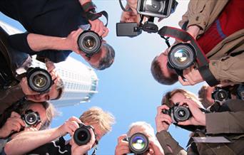 Looking up at a group of photographers