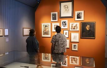 Visitors looking at artworks