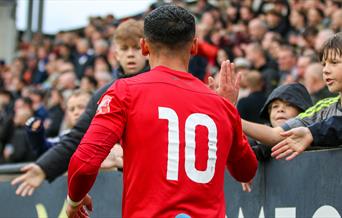 Footballer greeting the crowd