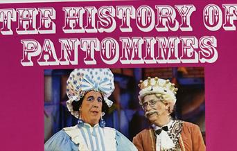 Pantomime dame character with fellow actor
