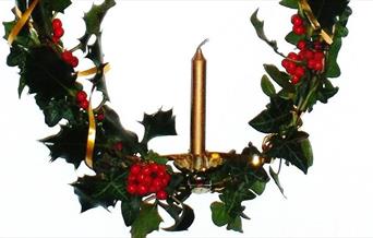 Holly wreath with candle