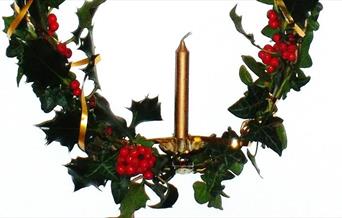 Holly wreath with candle