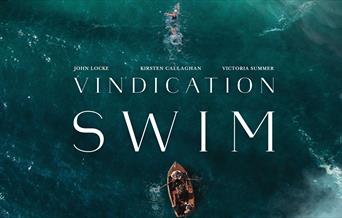 Drone shot of a channel swimmer with support boat