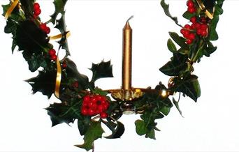 Christmas candle with holly