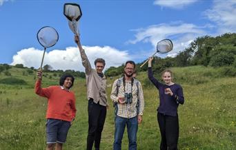 Attendees at Youth Action Project with butterfly nets and cameras