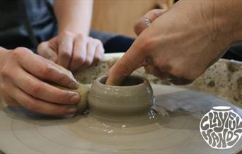 Using a pottery wheel