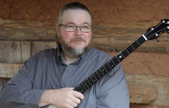 Musician Riley Baugus with his banjo