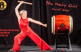 Storyteller Kersti Stabi ready to beat a drum.