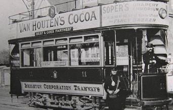 Old b/w photo of open topped tram