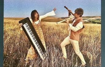 Musicians Piers Adams and Lyndy Mayle in a cornfield