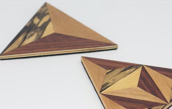 a pair of marquetry coasters